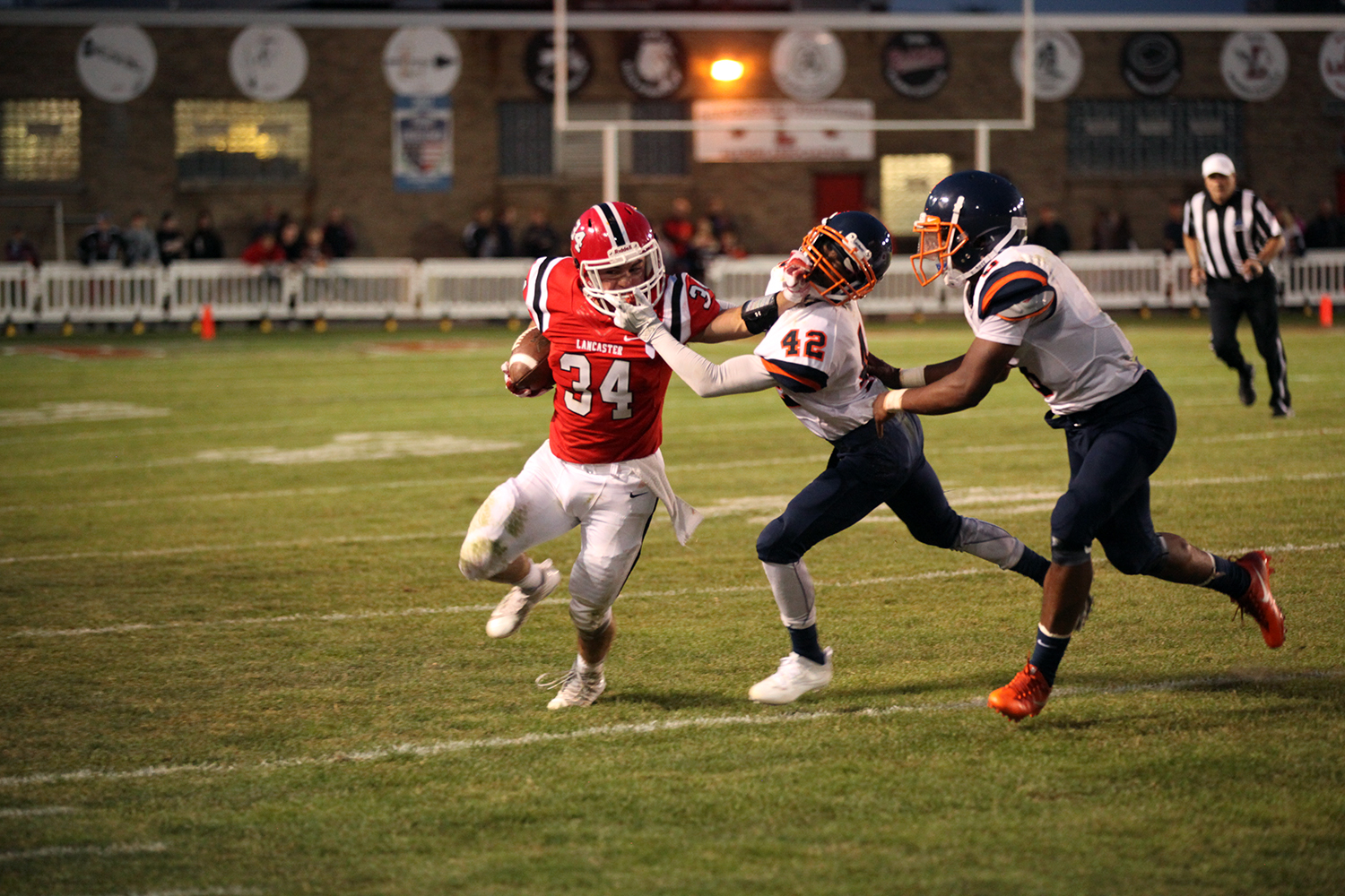 Both players gabbing facemasks Lancaster Legends Football 09.01.17 Lancaster vs Bennett