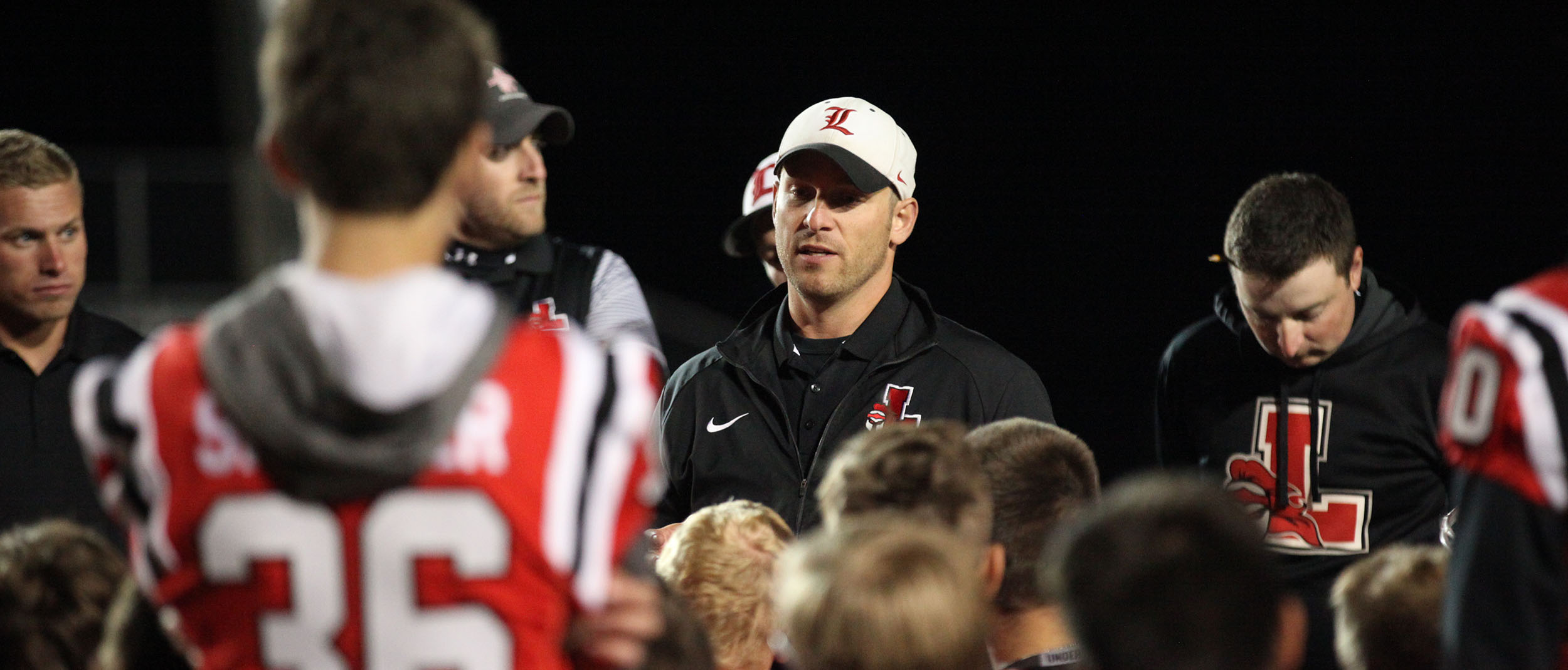 Coach Rupp talking to his team after the win