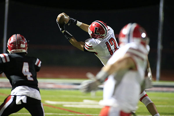 Lancaster WR going up for the catch