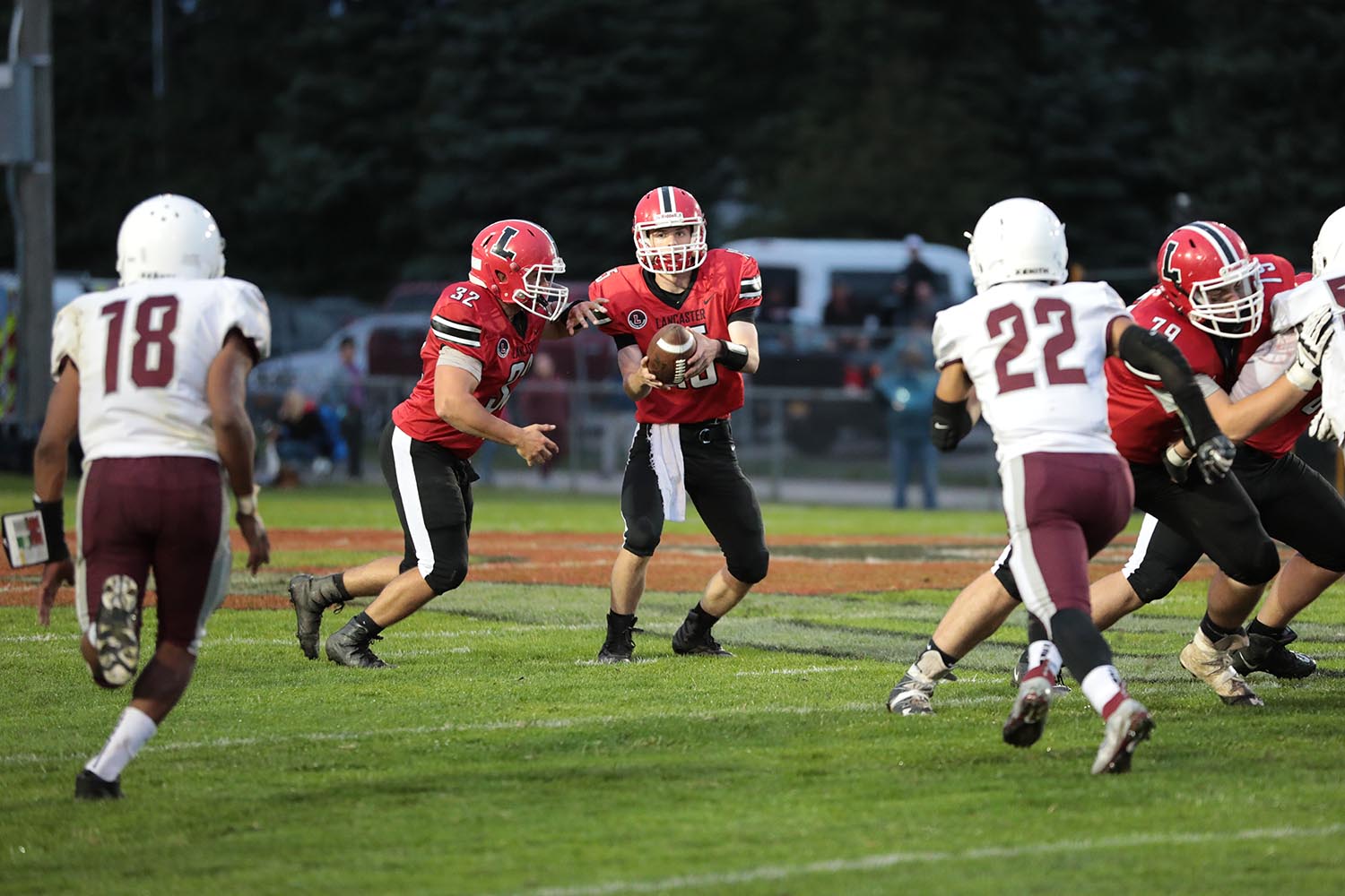 Lancaster Legends QB handing the ball off