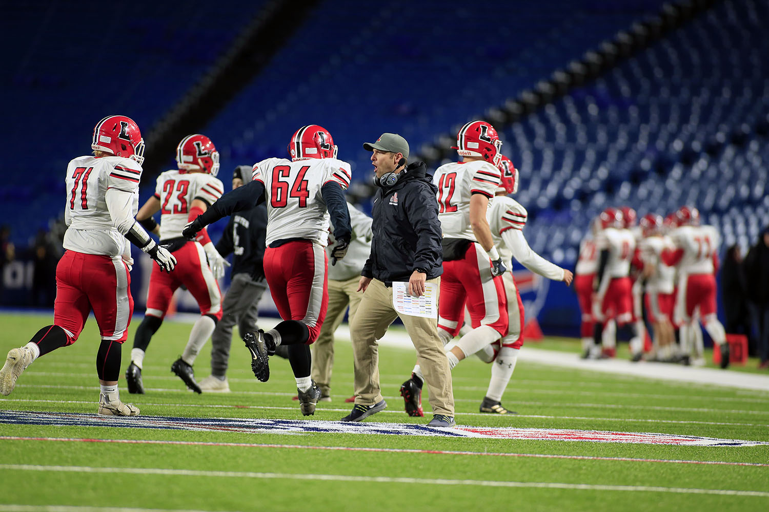 Coach Rupp excited as team comes off the field