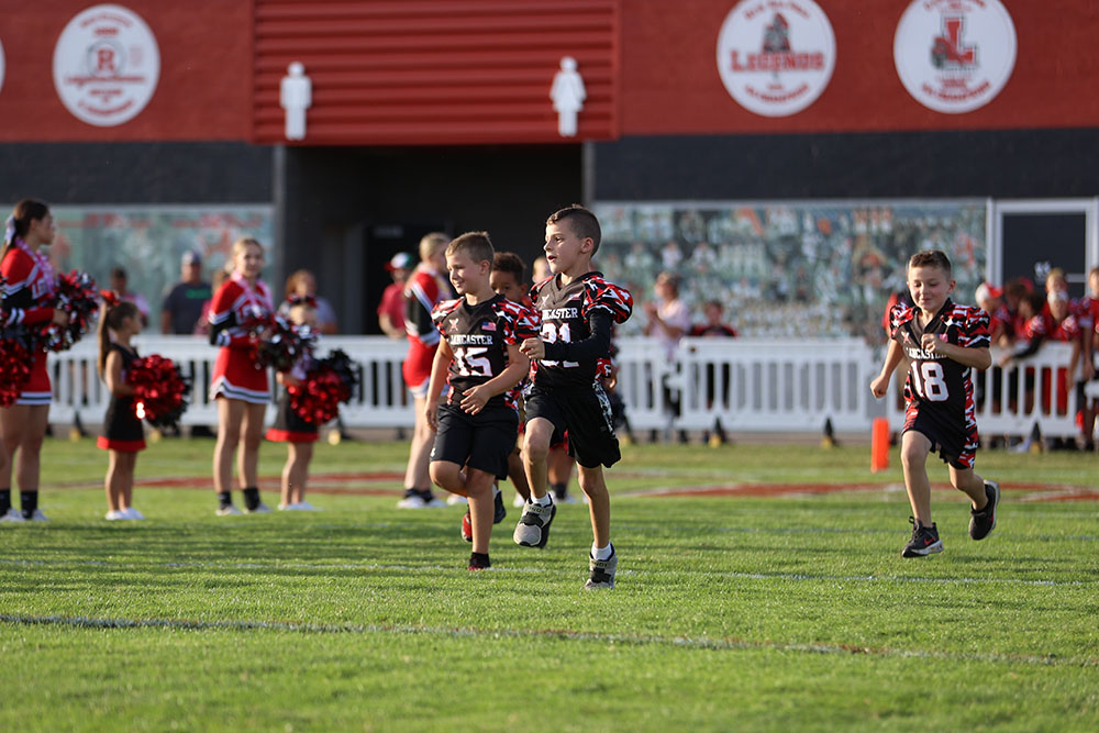 Lancaster Youth Football Youngsters running on the field