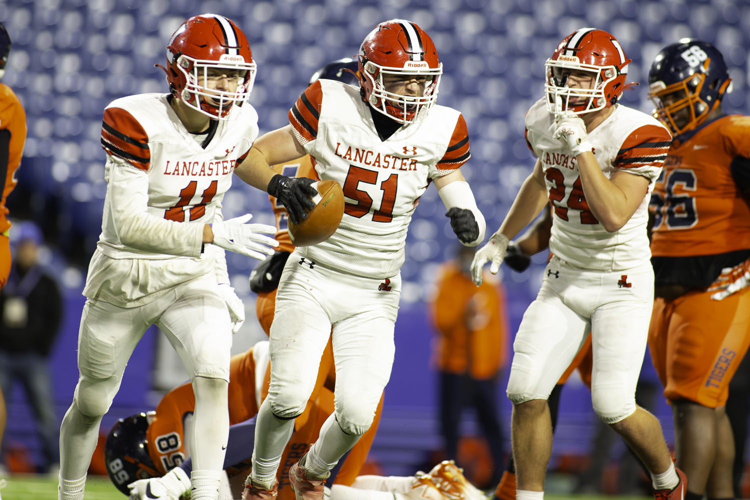 Lancaster celebrats after fumble recovery