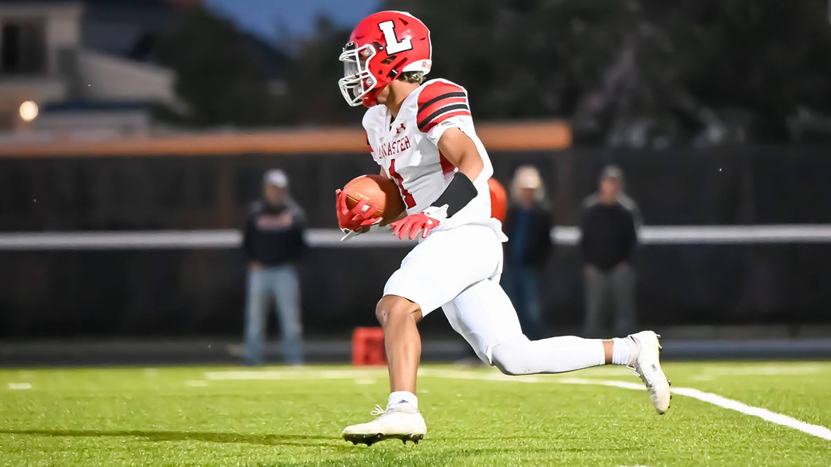 Jayden Colon running the ball down the field