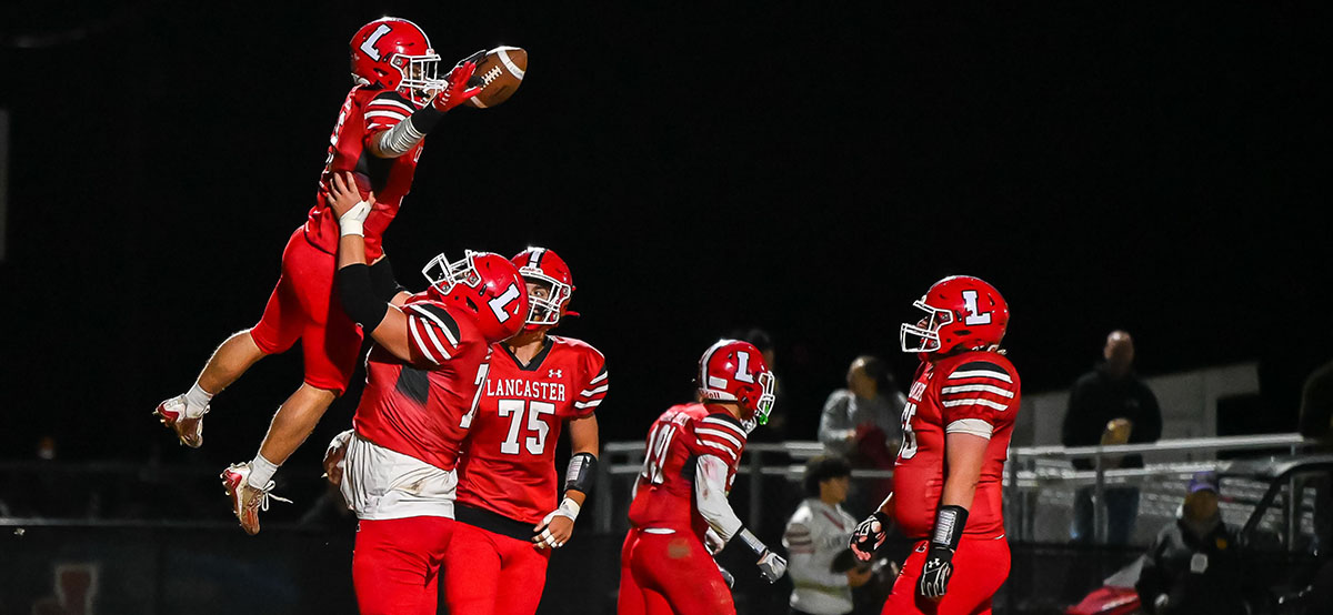 Gill and company celebrating a Touchdown against Canisius