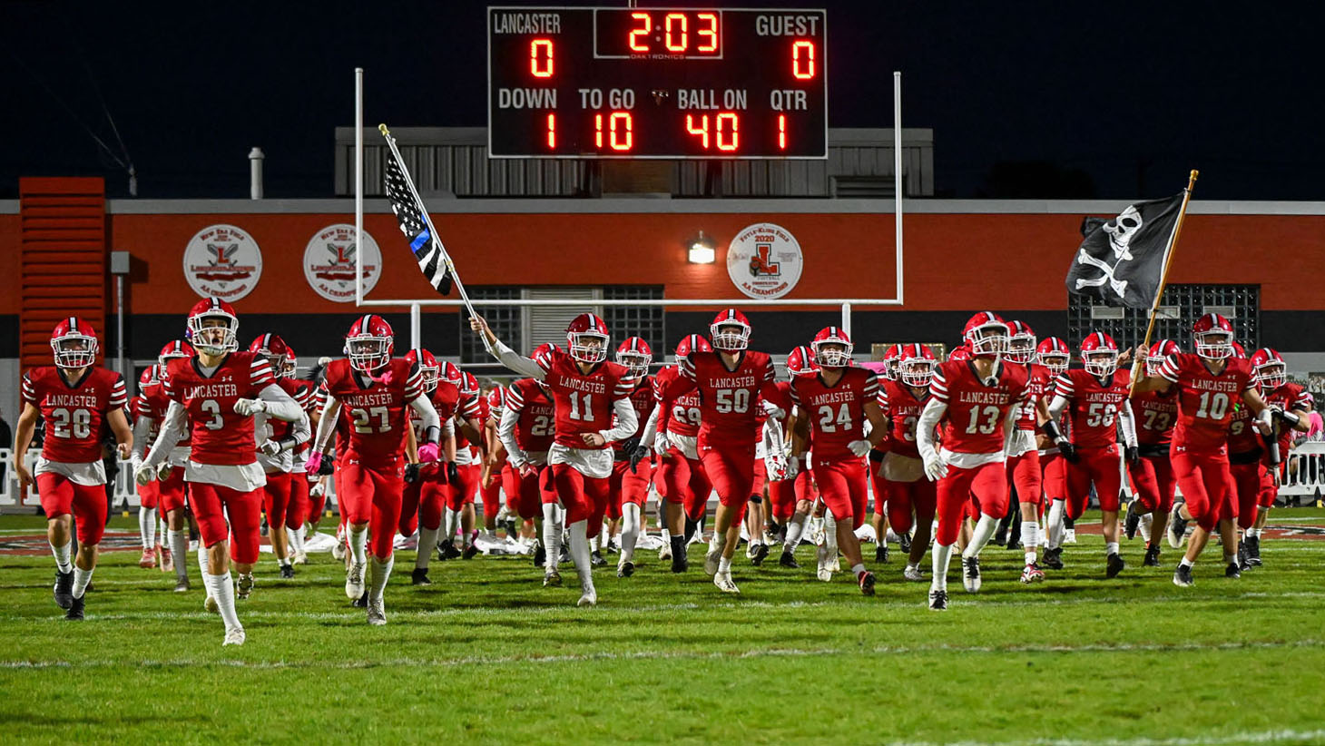 Lancaster Football running onto Foyle/Kling Field