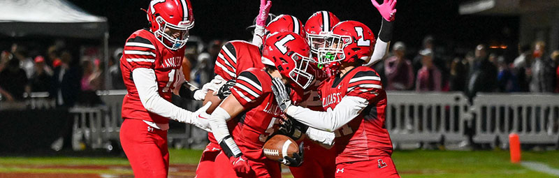 Lancaster Football celebrating TD in the endzone against Canisius