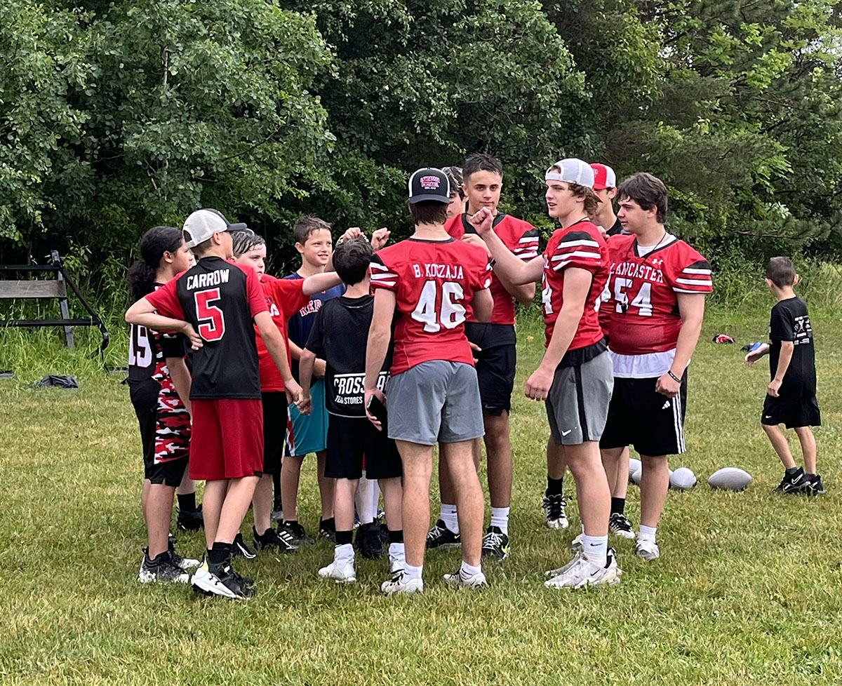 Campers huddle up at the end of the drill