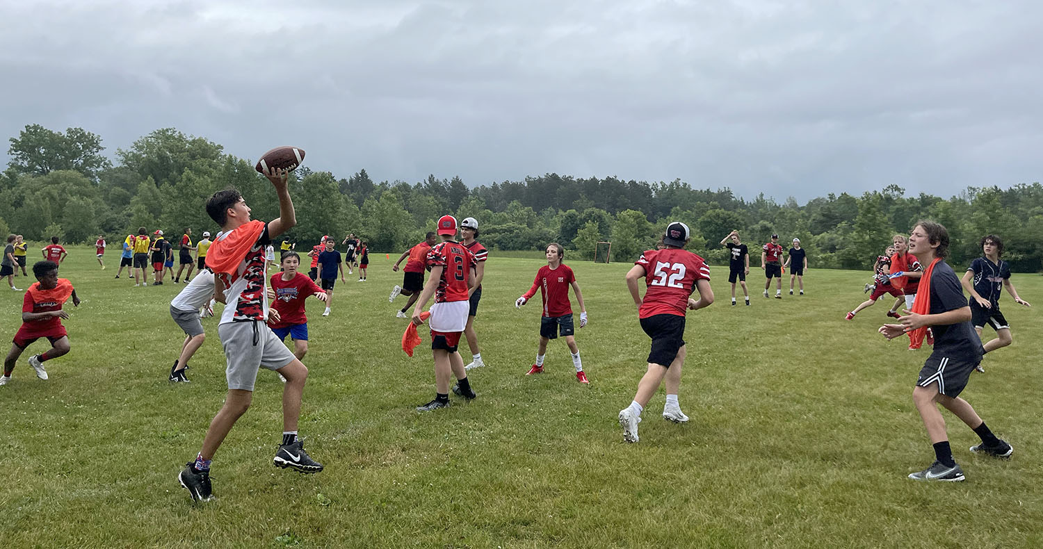 Quarterback throwing the ball down the field