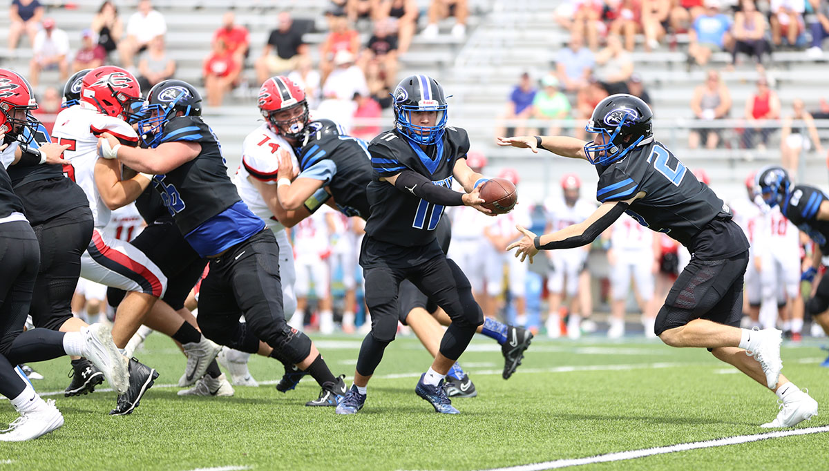 Frontier Falcons QB handing the ball off