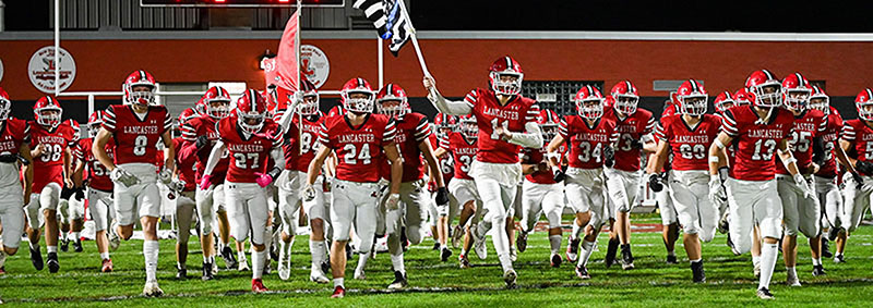 Lancaster Football celebrating TD in the endzone against Canisius