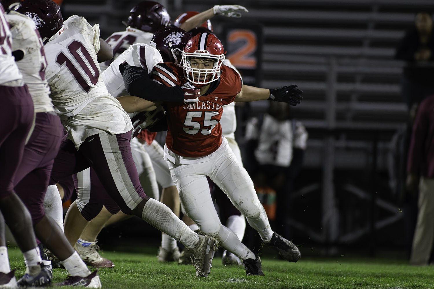 Lancaster lineman reaching for the runningback