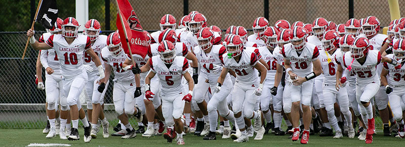 Lancaster Football hitting the field against Hutch Tech