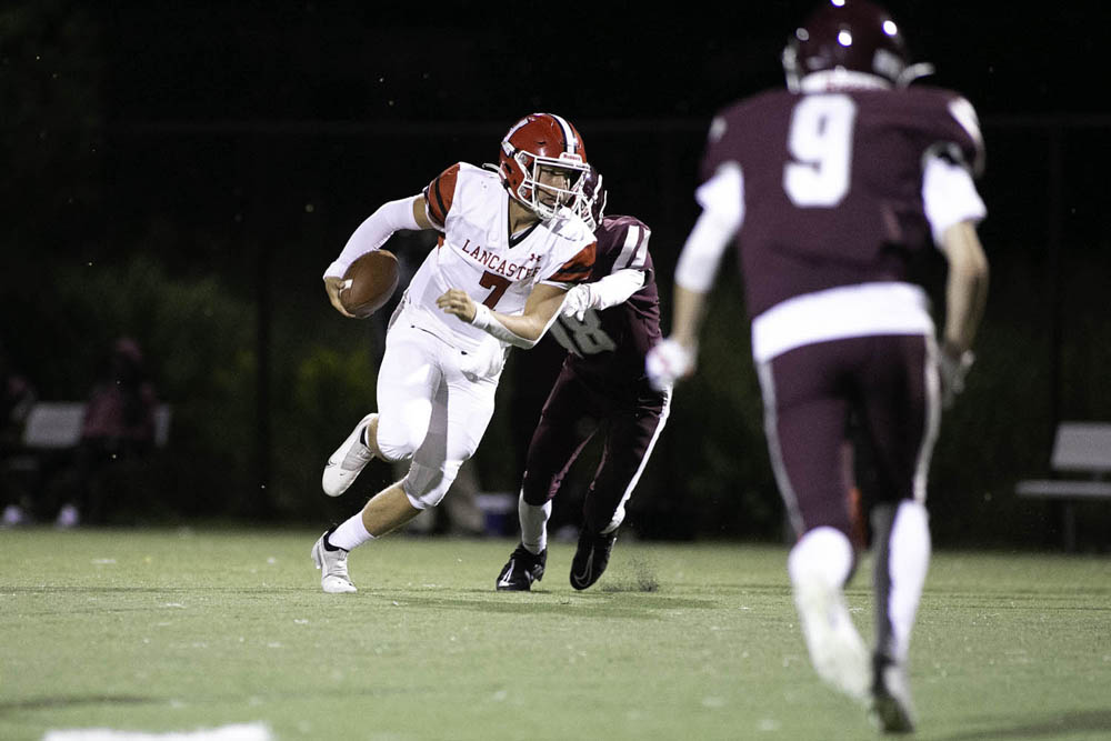 Lancaste QB running the ball