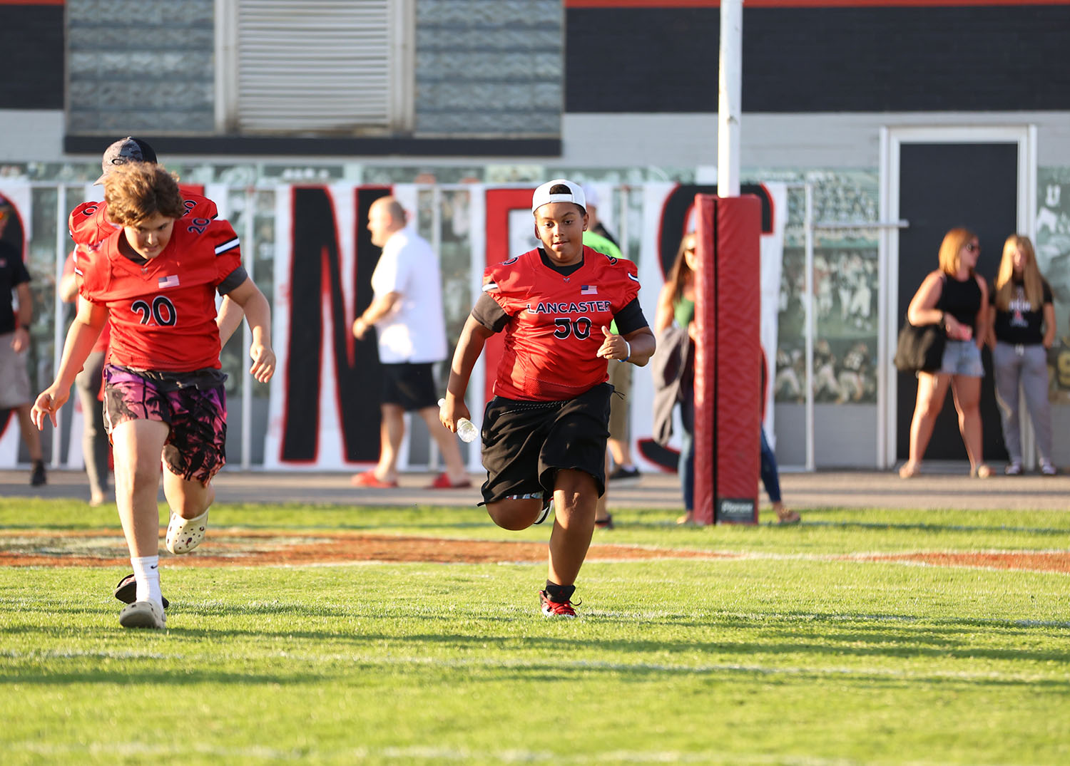 Lancaster youth football players on the field