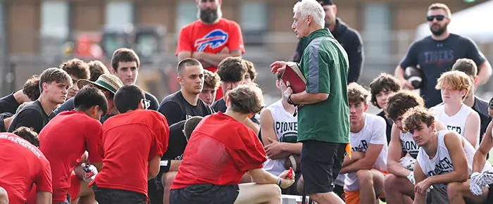 Coach speaking to the teams