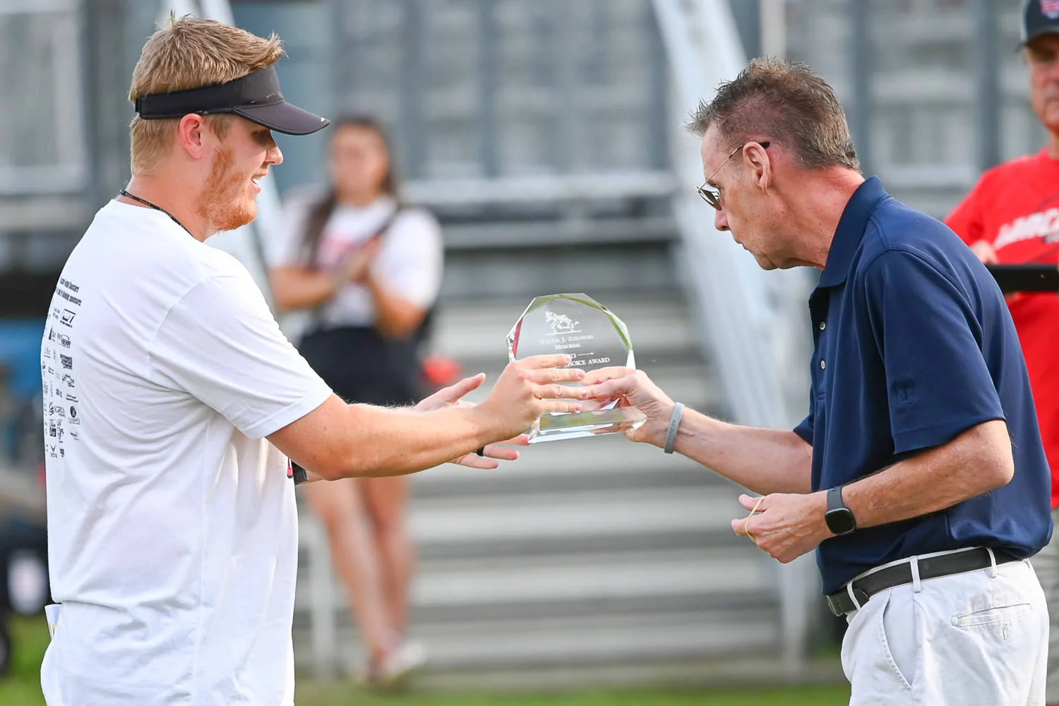 Coach Handing out Awards