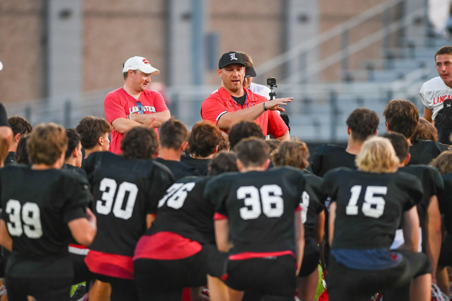 Coach Rupp talking to the team