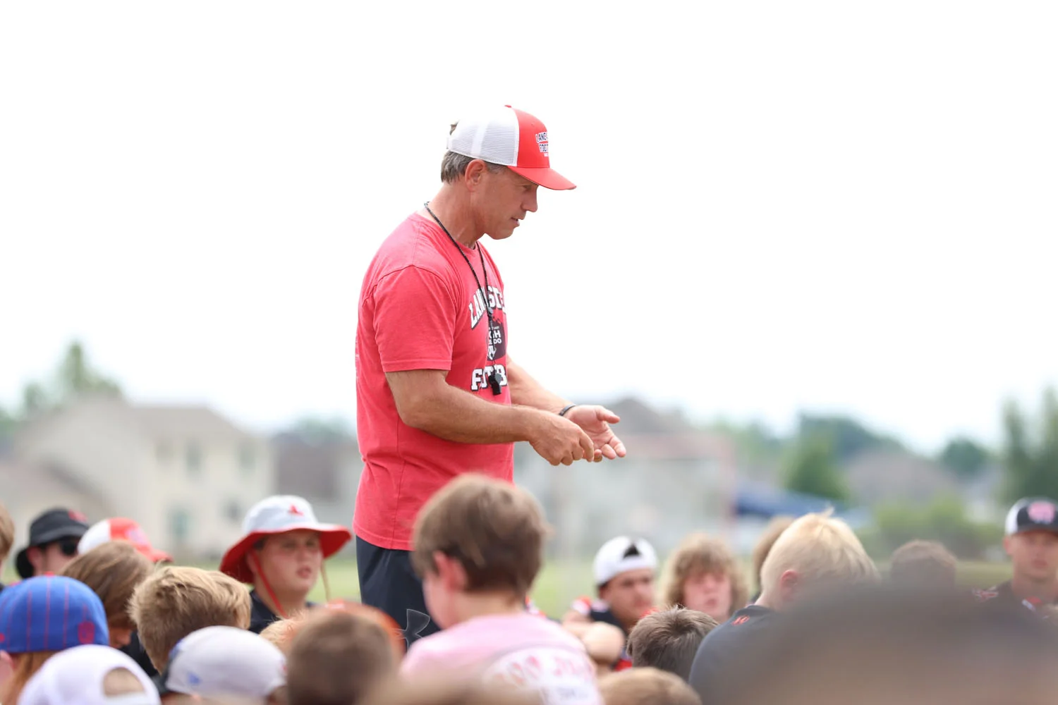 Coach Mansell speaking to the campers