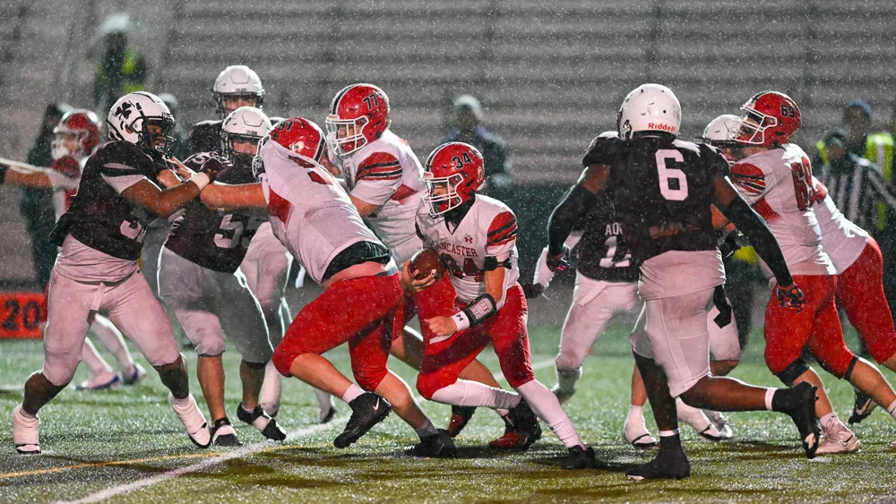 RB running between the raindrops