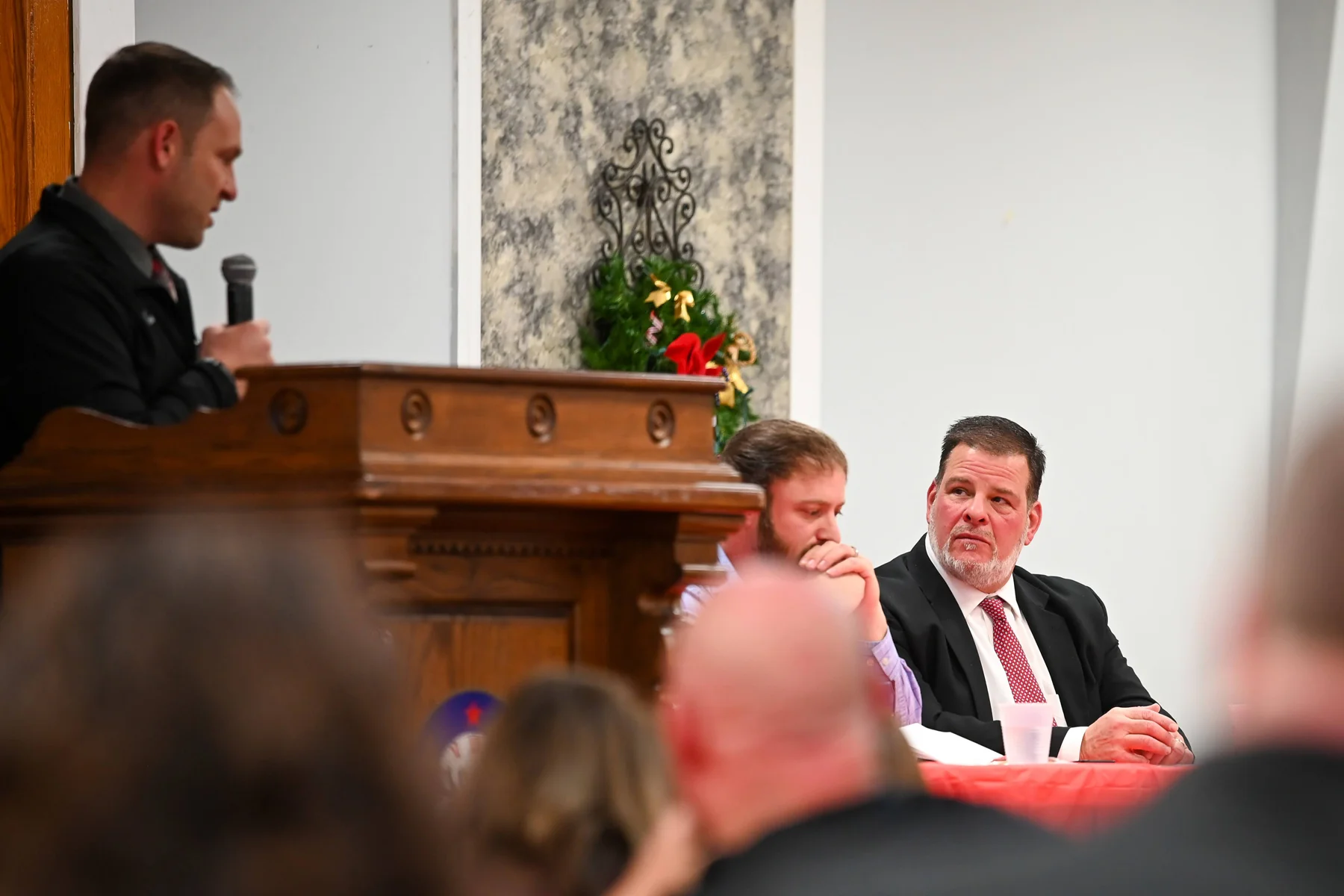 Coach Rupp talking with Coach Wild listening