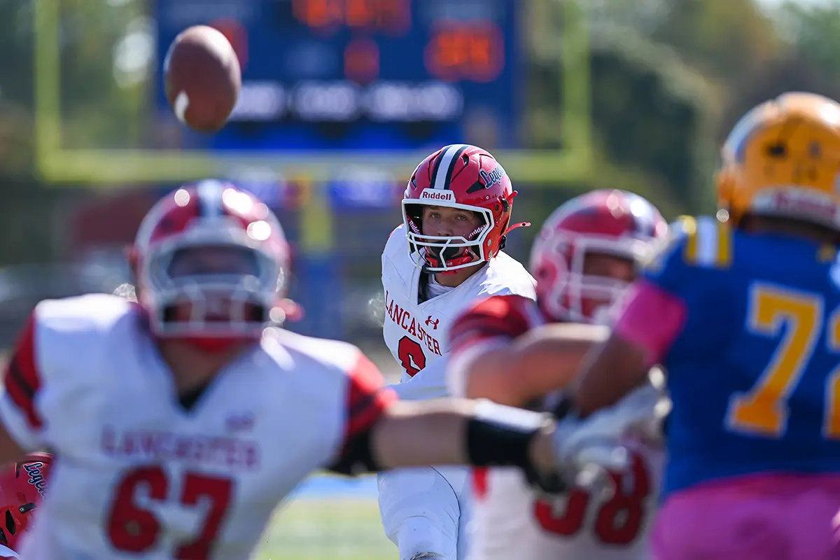 Lancaster player kicking the extra point