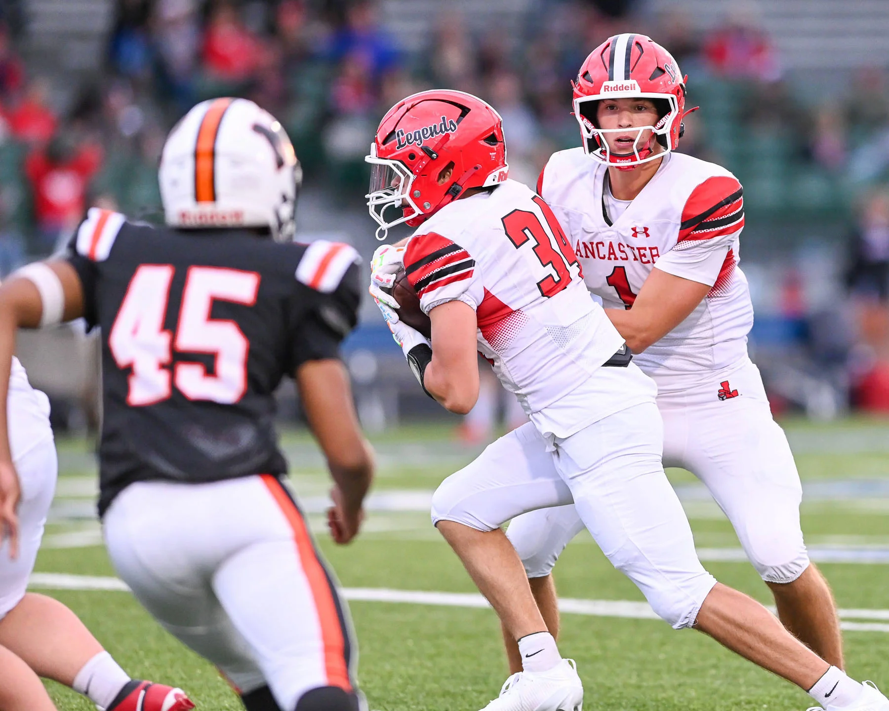Lancaster QB handing the ball off