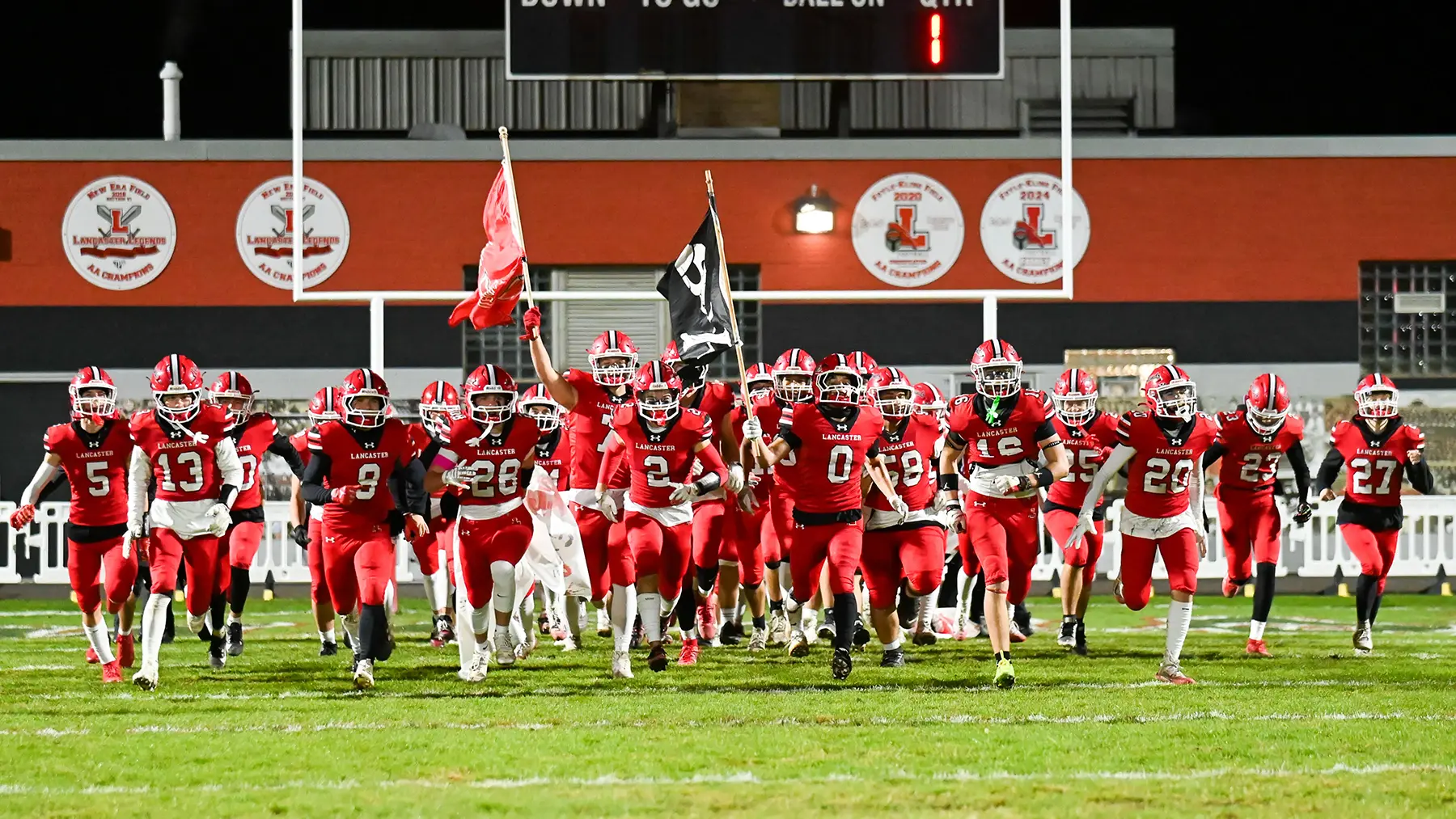 Lancaster Legends running onto the field