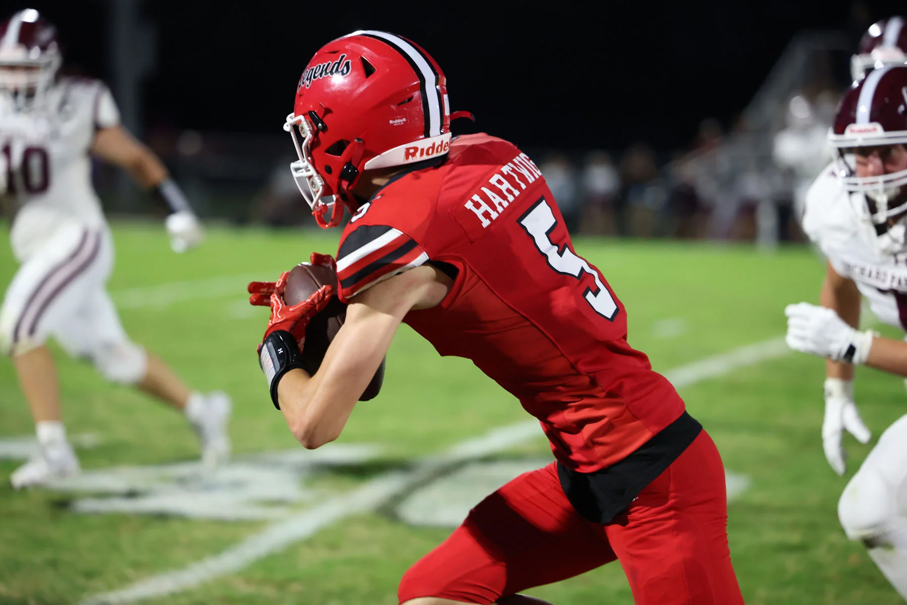 WR turning and running with the ball