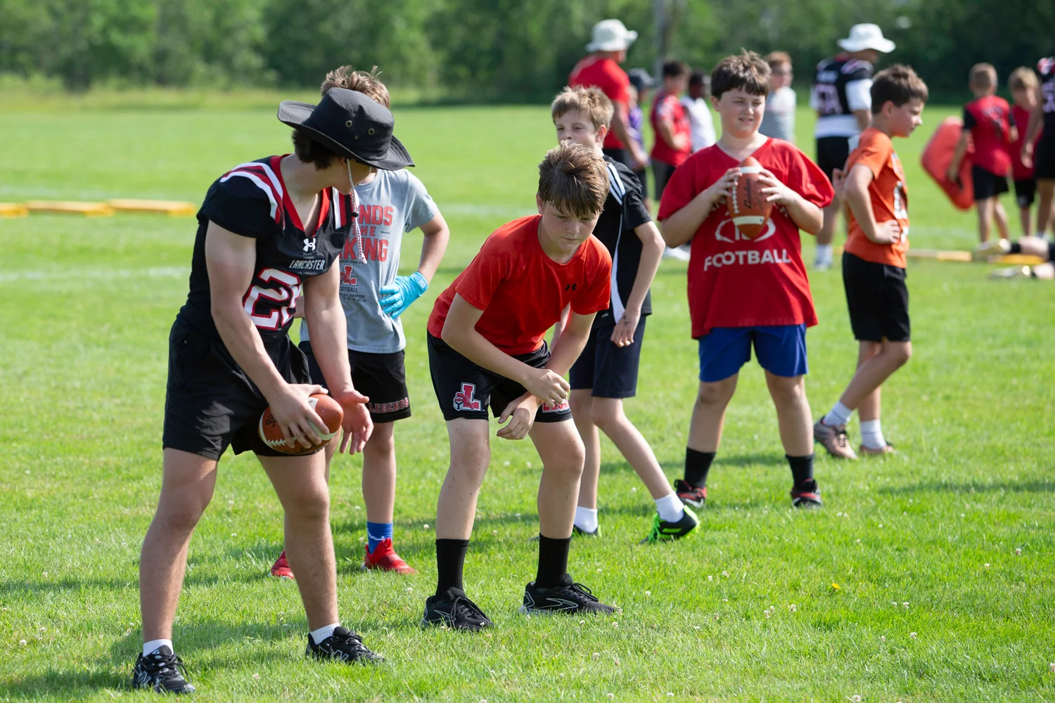 Campers getting coached up at the Lancaster Football Camp 2026