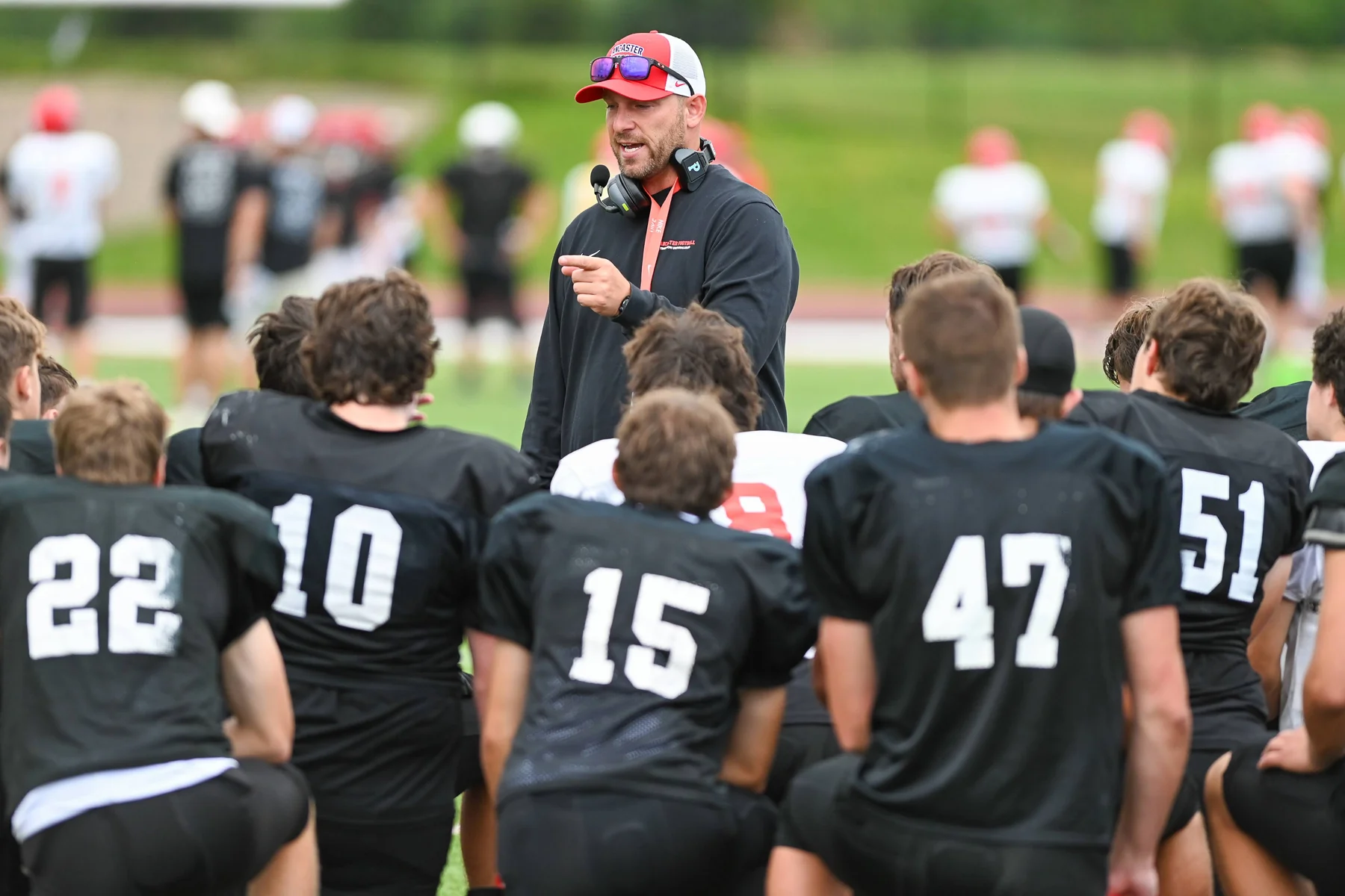 Coach Rupp talking to his squad after the Lancaster Football Scrimmage 2026