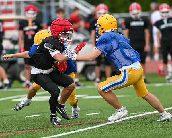 Lancaster RB giving a stiff arm