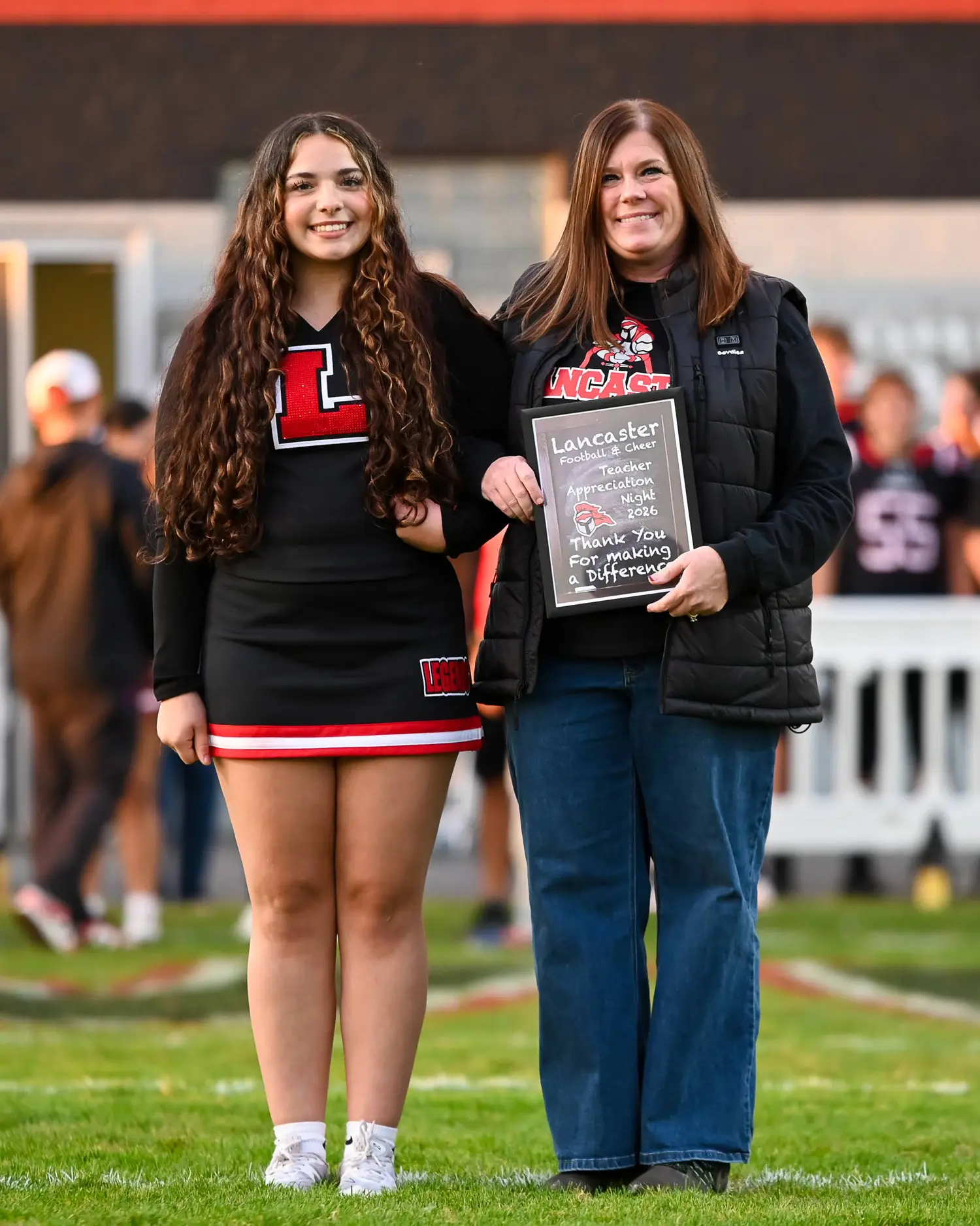 Cheerleader and Teacher on Teacher Appreciation Night
