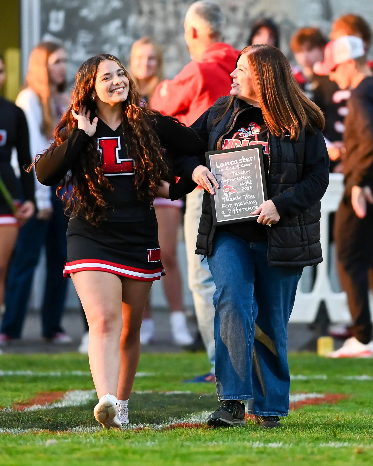 Cheerleader and Teacher on Teacher Appreciation Night