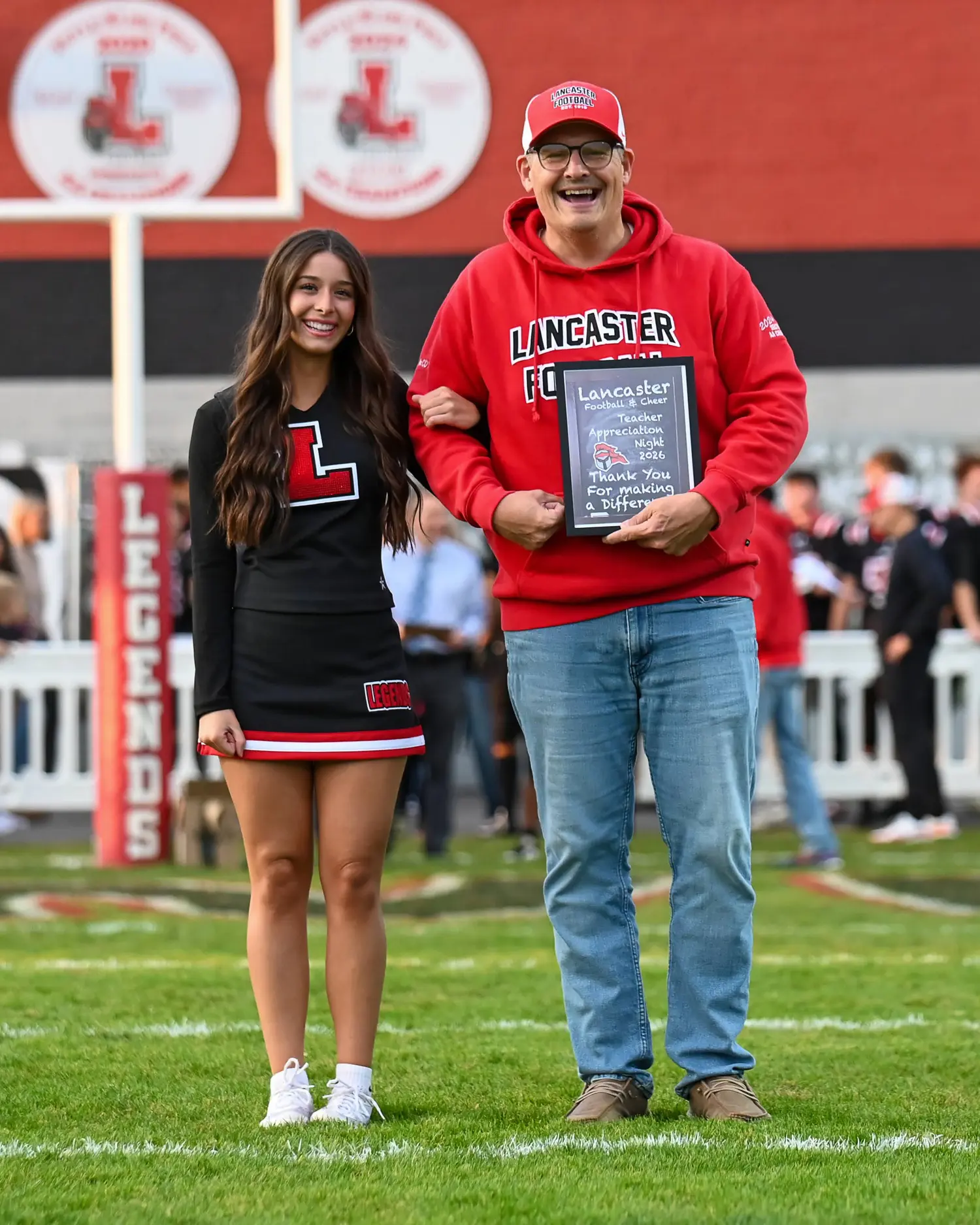 Teacher and Cheerleader on Teacher Appreciation Night